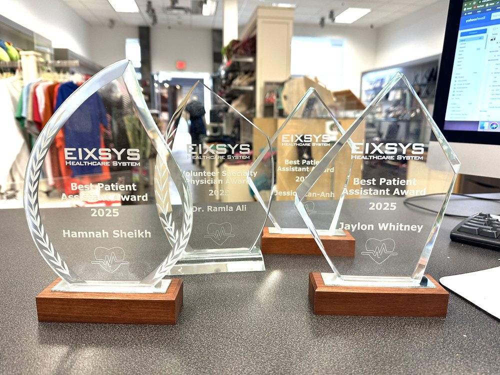 Crystal EIXSYS Healthcare System awards engraved with recipient names