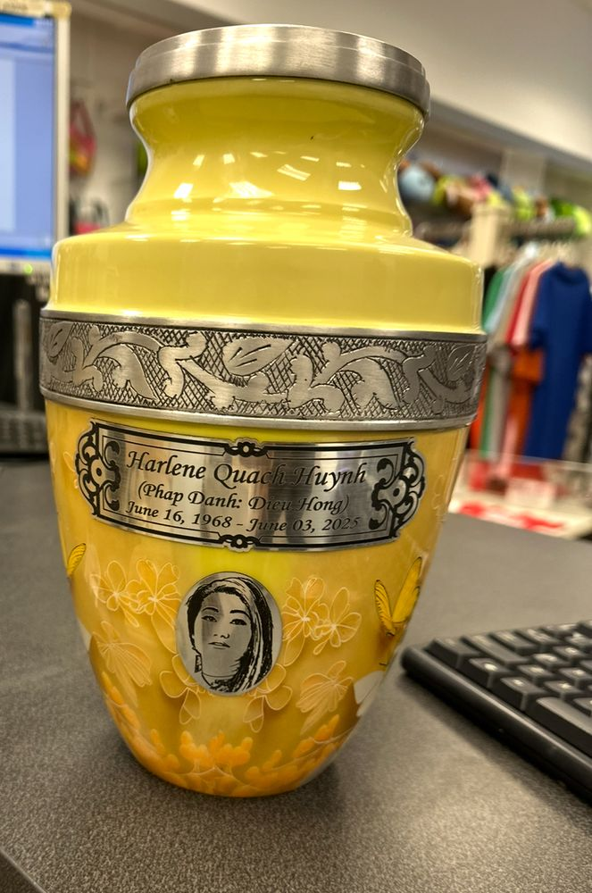 Memorial urn engraved with a name plate and portrait